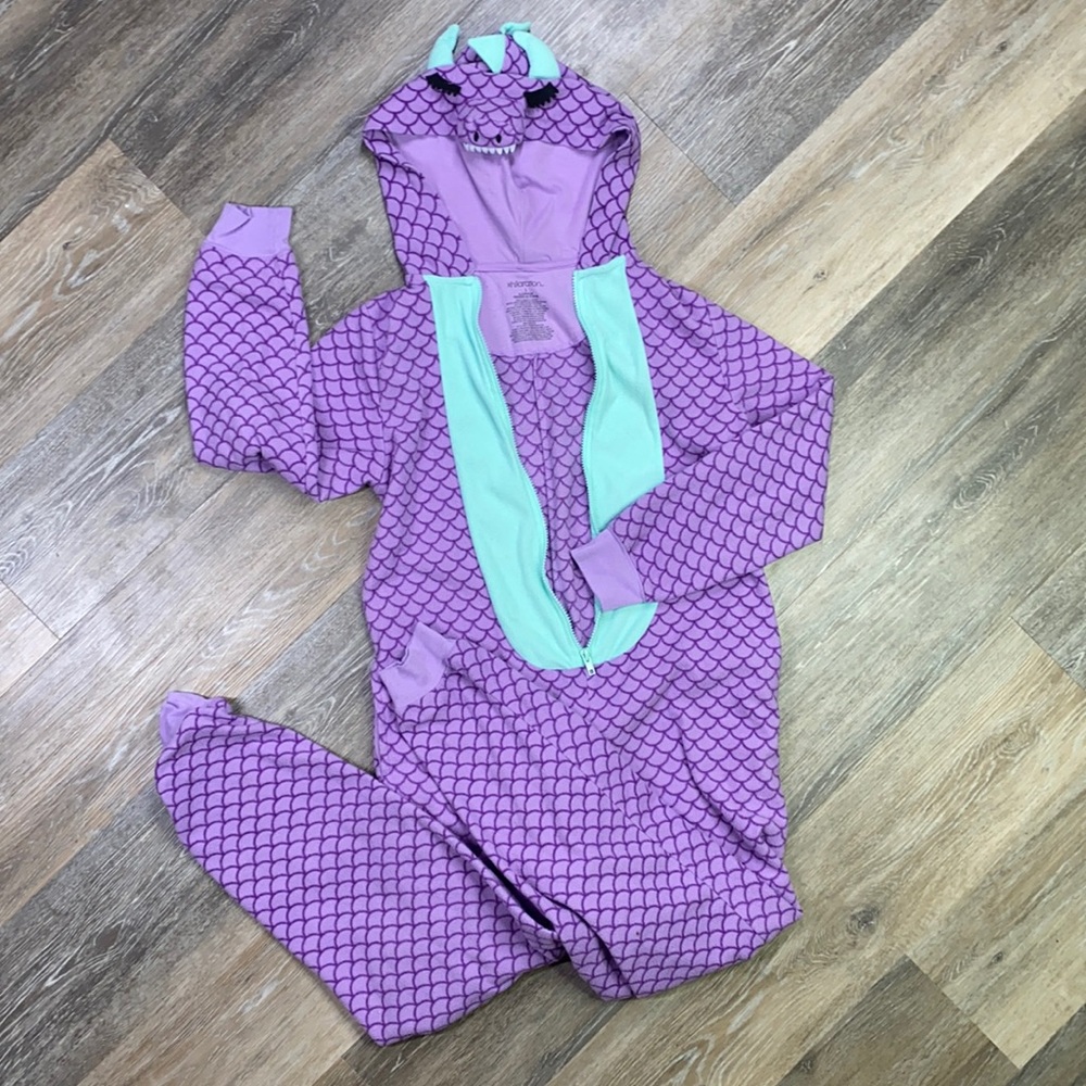 Woman’s purple and minty blue dragon onesie